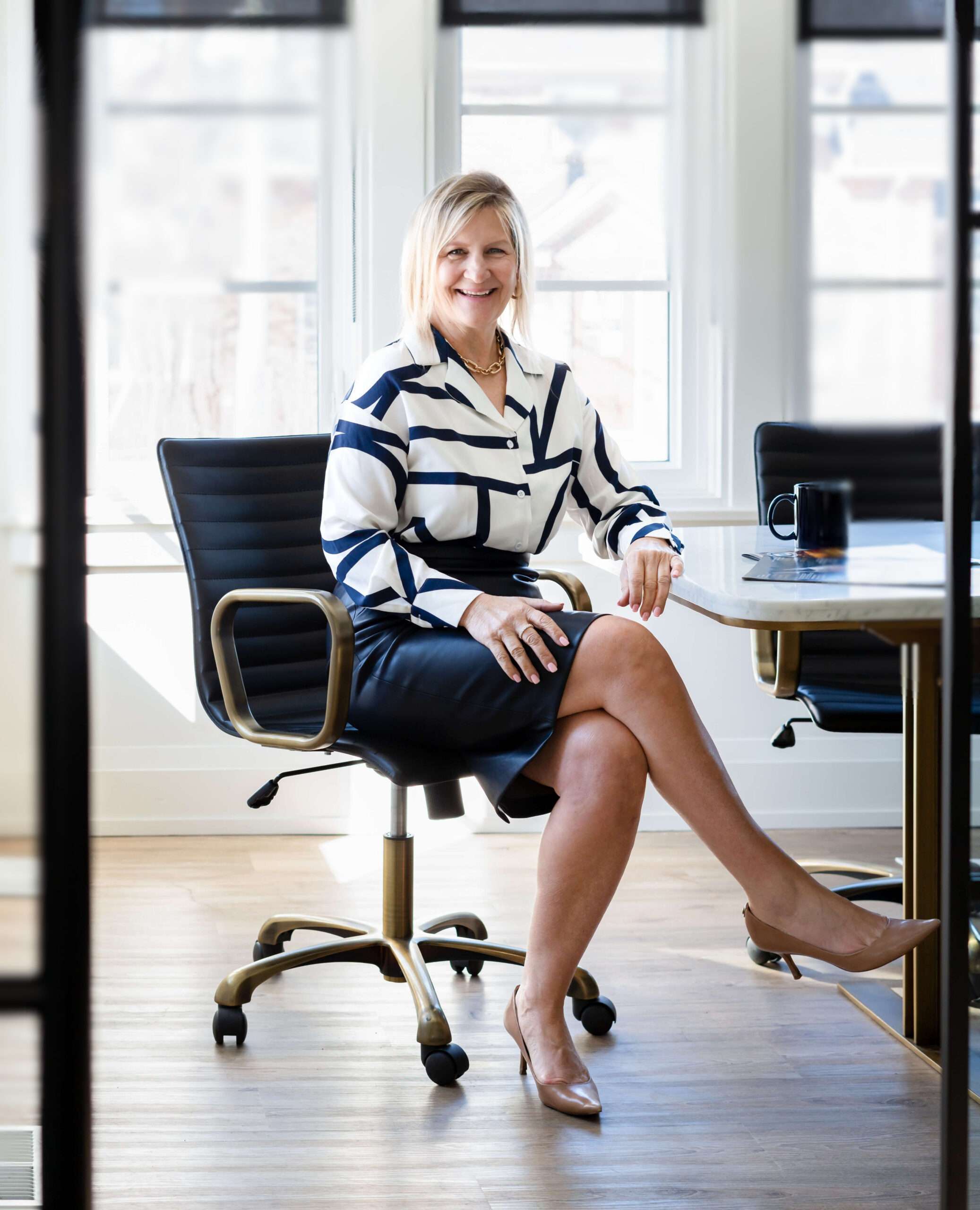Karen Roy sitting in an office chair
